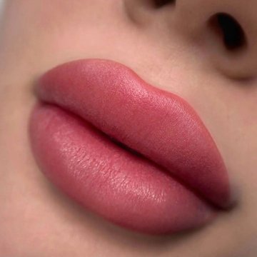 Soft pink lip tattoo